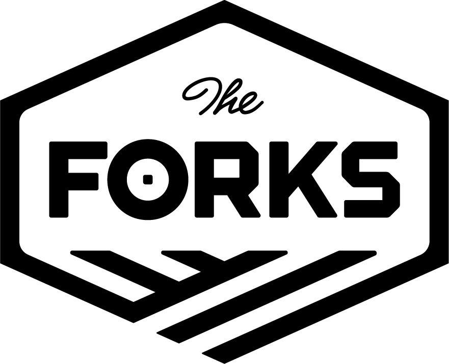 The Forks logo, a black hexagonal badge reading The Forks above two converging river lines